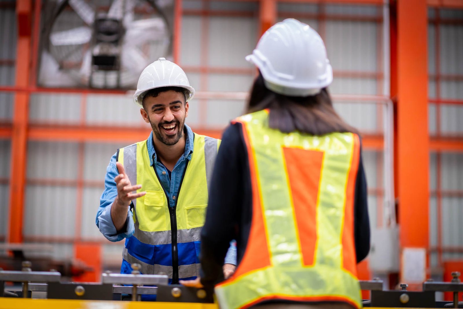 Young male engineer in metal sheet factory Responsible work is being inspected at the actual work site. Work professionally and happily